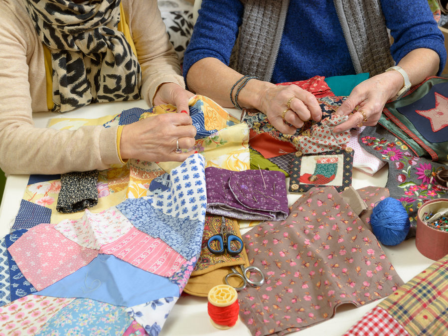 Two,Women,Working,On,Their,Patchwork,In,The,Workshop