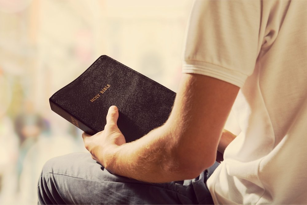 Man holding the bible